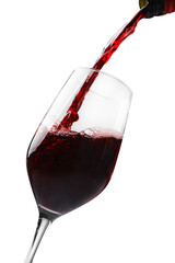 Pouring red wine into glass isolated on white