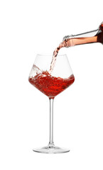 Pouring wine into glass on white background