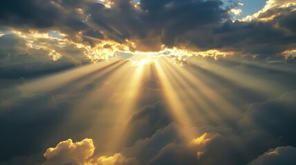 Dramatic sun rays breaking through the clouds in the sky