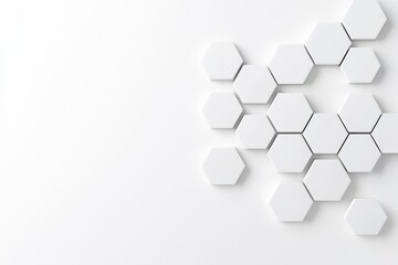 A white wall adorned with hexagonal shapes, showcasing a monochrome, contrasting hexagonal texture. An abstract pattern background. A photo of the decorated surface.