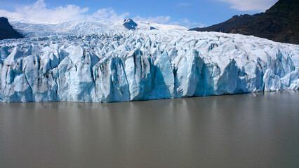 Aerial view of the ice cliffs in the front part of the Fjallsjokull glacier in southeast Iceland.  © Jose Lledo