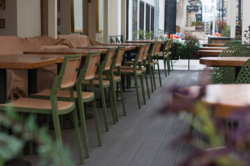 tables and chairs, armchairs in the cafe restaurant. A recreation area, a summer veranda and serving tables