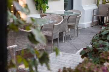 tables and chairs, armchairs in the cafe restaurant. A recreation area, a summer veranda and serving tables