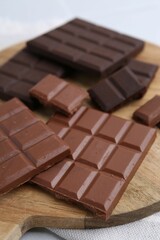 Different types of chocolate on light table, closeup
