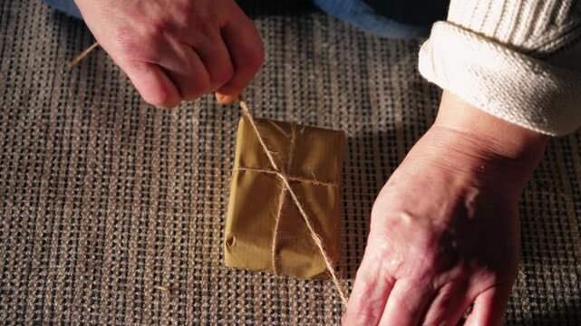 Wrapping gift in brown paper