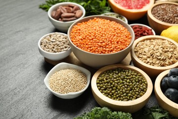 Superfood. Different healthy food products on grey table, closeup