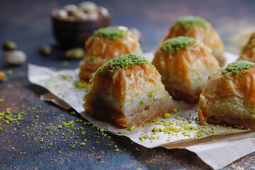 Turkish-style pistachio baklava with a glass of milk.