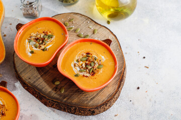 Traditional autumn butternut squash soup with seeds.