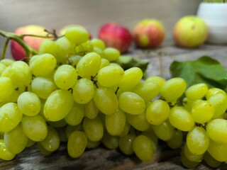 Green ripe juicy grapes on the table.