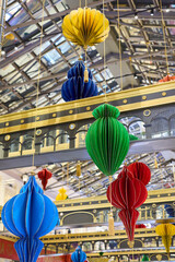A Beautiful Array of Colorful Hanging Lanterns Featuring Style in a Modern Atrium Space