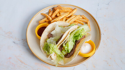 Delicious Italian sandwich with vegetables and fries