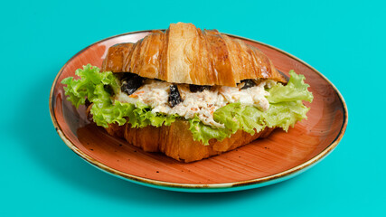 Croissant sandwich on plate