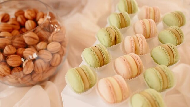 Close up view Candy Bar Wedding, candy buffet wedding move camera. delicious sweet turquoise snacks, candy bar with cupcakes, cakepops, macaroons, cake, bize and other sweets and cookies Banquet Hall