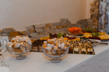 Elegant Dessert Table Displaying Assorted Sweets and Fruits