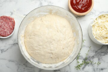 Making calzone pizza. Different ingredients on white marble table, flat lay