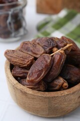 Tasty dried dates on white table, closeup