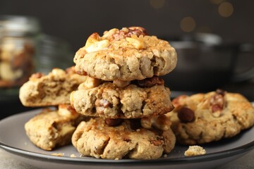 Tasty cookies with nuts on table, closeup