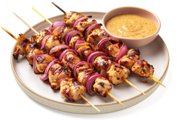 Grilled chicken skewers with peanut sauce and red onion on a transparent background