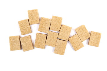 Pile brown sugar cubes isolated on white background, top view
