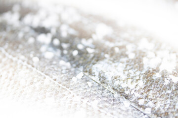 Close Up of Fish Skin and Scales With Sea Salt Abstract Macro Background Basa Cod