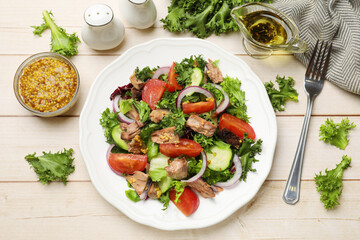 Delicious fresh tuna salad served on wooden table, flat lay