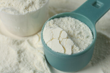 Pile of protein powder and scoops, closeup