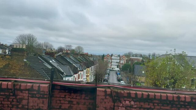 Window view from a moving underground train arriving at east putney station in London, England