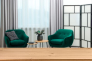 Empty wooden table in beautiful living room. Space for design