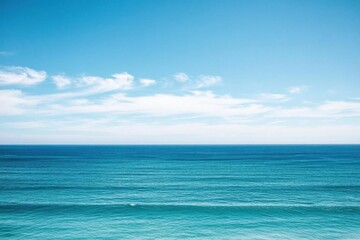 Obraz premium A serene ocean view under a clear blue sky, evoking tranquility.