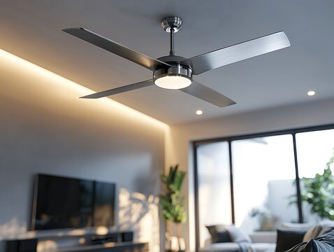 A silver ceiling fan with sleek, modern blades, adding a touch of elegance to a contemporary room.
