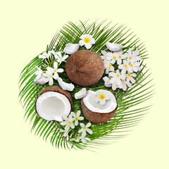 Coconuts, tropical flowers and leaves on beige background