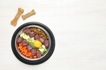 Dry pet food and natural products on white table, top view. Space for text