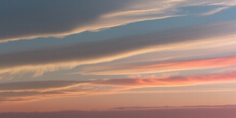 Fototapeta premium Serene Sunset Sky with Colorful Clouds and Soft Pastel Hues