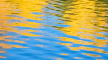 Reflection of Yellow and Blue Colors on Calm Water Surface in Nature