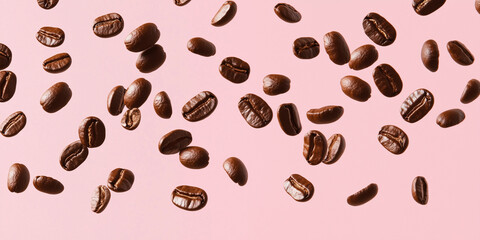 Coffee beans falling on white background