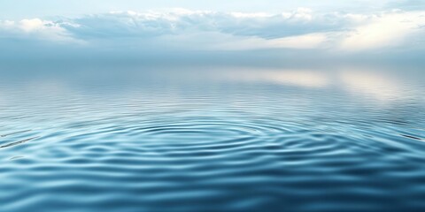 Obraz premium A serene water surface reflecting clouds, creating a tranquil atmosphere.