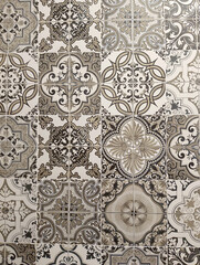 seamless pattern of decorative ceramic tiles with ornate floral and geometric designs in grayscale