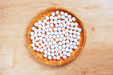Balls of tasty tangyuan on wooden table   