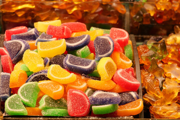 sugar coated jelly beans in the form of colored sliced fruit