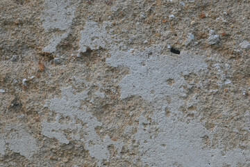 texture of a rough old wall. background and texture of a rough old building wall. old cracked wall