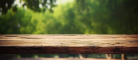 Fototapeta premium Beautiful Empty Wooden Table Surrounded by Lush Green Trees in Natural Light, Perfect for Displaying Products or Food Photography