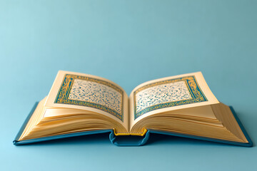 Open Book with Gold-Edged Pages and Intricate Script on Light Blue Background