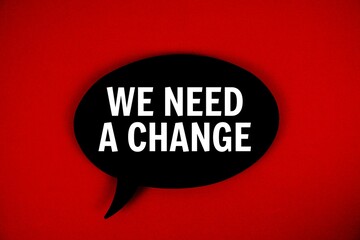 We Need A Change text with speech bubble on red background