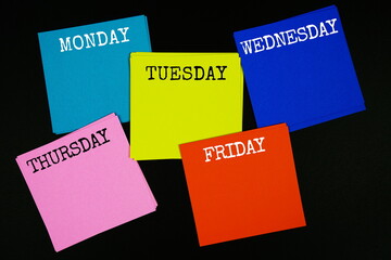 Monday To Friday text with sticky note on black background