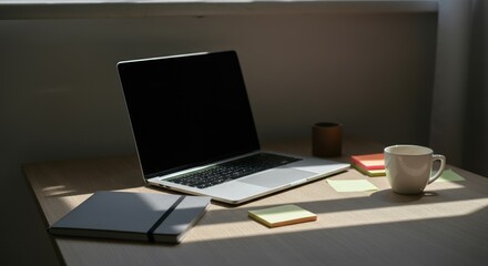 Minimalist workspace with laptop, notebook, sticky notes, and coffee mug on wooden desk