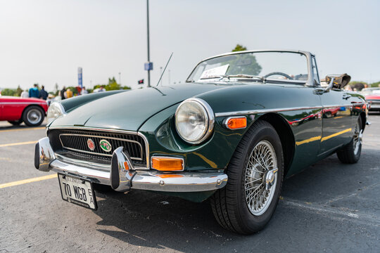 Chicago, Illinois, USA - September 08, 2024: MG MGB sportscar retro convertible vehicle, front view. Retro red sportscar. Convertible MG MGB car. MG MGB at Chicago