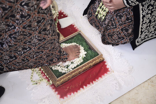 Wijikan or ranupada, the procession of the bride washing the groom's feet. Indonesian javanese traditional wedding ceremony.