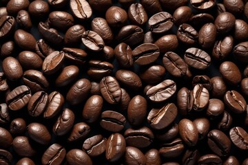 Obraz premium a close up of a pile of coffee beans with a black background