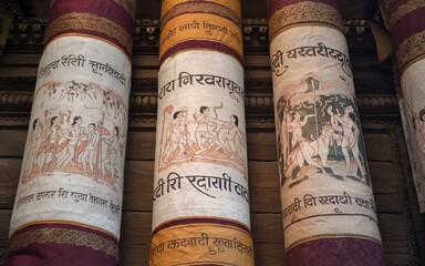 Ancient scrolls with hand-painted mythological scenes.