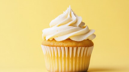 Delicious Vanilla Cupcake with Creamy Frosting on Yellow Background